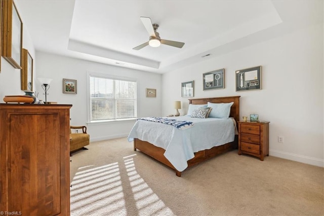755 Gibb St, Winston-Salem, NC 27106 - bedroom featuring a raised ceiling, baseboards, light carpet, and ceiling fan