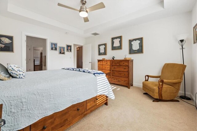 755 Gibb St, Winston-Salem, NC 27106 - bedroom with a tray ceiling, light colored carpet, baseboards, and a ceiling fan