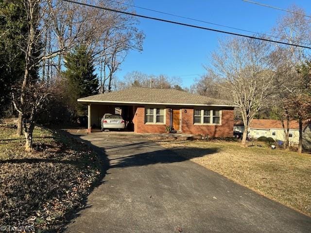 view of front of house featuring a carport