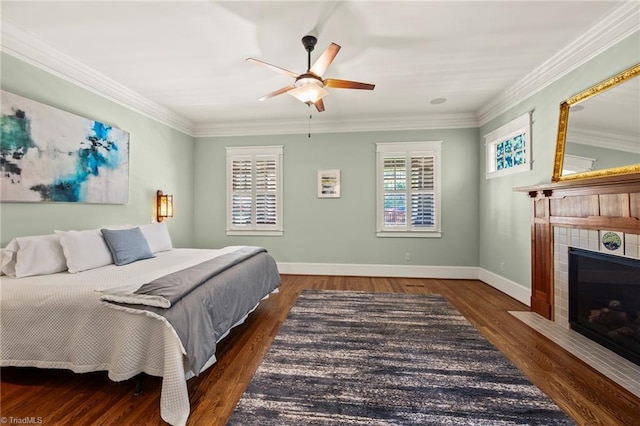 239 Glade View Ct, Winston-Salem, NC 27101 - bedroom with a fireplace, crown molding, wood finished floors, baseboards, and a ceiling fan