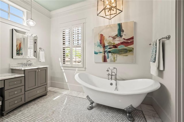 239 Glade View Ct, Winston-Salem, NC 27101 - bathroom featuring baseboards, a soaking tub, marble look tile flooring, vanity, and crown molding