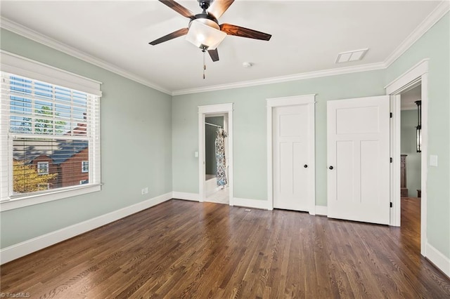 239 Glade View Ct, Winston-Salem, NC 27101 - unfurnished bedroom featuring crown molding, baseboards, dark wood finished floors, a ceiling fan, and connected bathroom