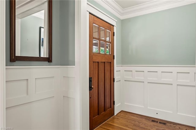 239 Glade View Ct, Winston-Salem, NC 27101 - entryway with a decorative wall, crown molding, wood finished floors, and a wainscoted wall
