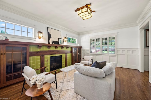 239 Glade View Ct, Winston-Salem, NC 27101 - living room with healthy amount of natural light, a tile fireplace, ornamental molding, wood finished floors, and wainscoting