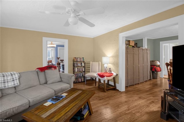 living room with hardwood / wood-style flooring and ceiling fan