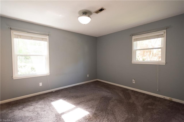 3607 Stonehurst Pl, High Point, NC 27265 - carpeted empty room featuring baseboards, plenty of natural light, and visible vents
