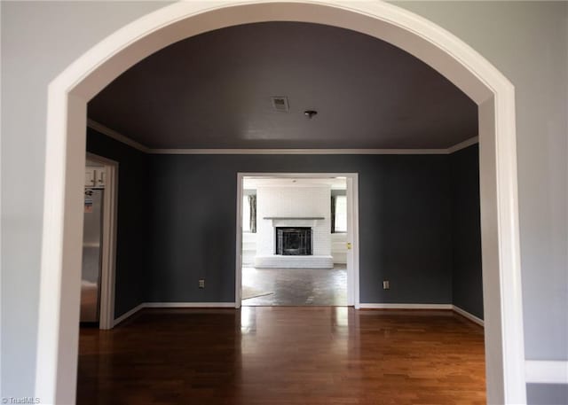 3607 Stonehurst Pl, High Point, NC 27265 - interior space featuring arched walkways, ornamental molding, baseboards, and wood finished floors