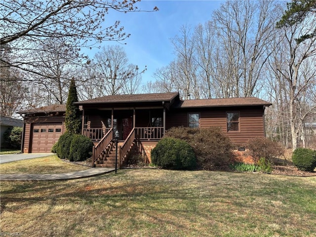 view of front facade with driveway, a porch, stairway, a front yard, and a garage