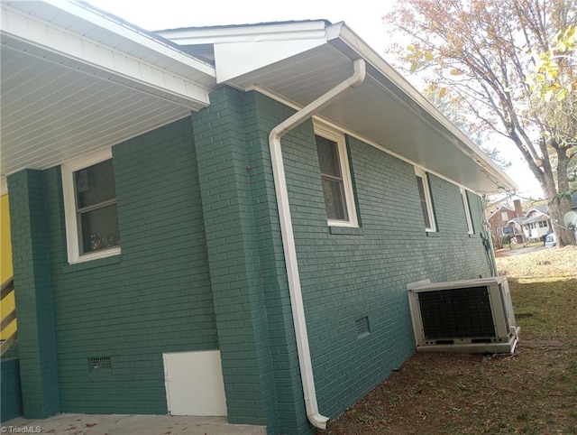 view of property exterior with central AC