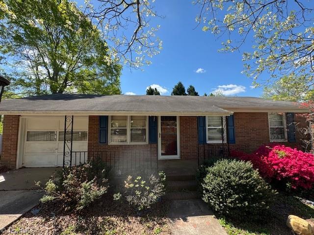 1226 Lewis St, Eden, NC 27288 - single story home featuring brick siding, an attached garage, and driveway