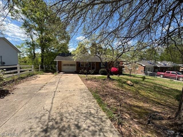 1226 Lewis St, Eden, NC 27288 - single story home with concrete driveway and a garage
