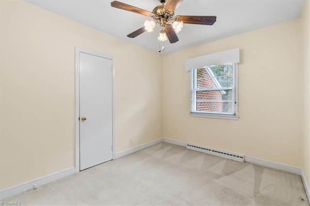 unfurnished room featuring ceiling fan, light colored carpet, and a baseboard radiator