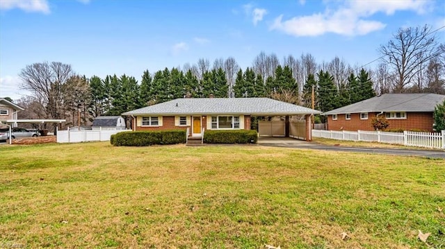 ranch-style home featuring a carport and a front lawn