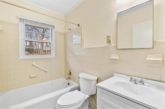 full bathroom featuring ornamental molding, toilet, vanity, tile walls, and tiled shower / bath