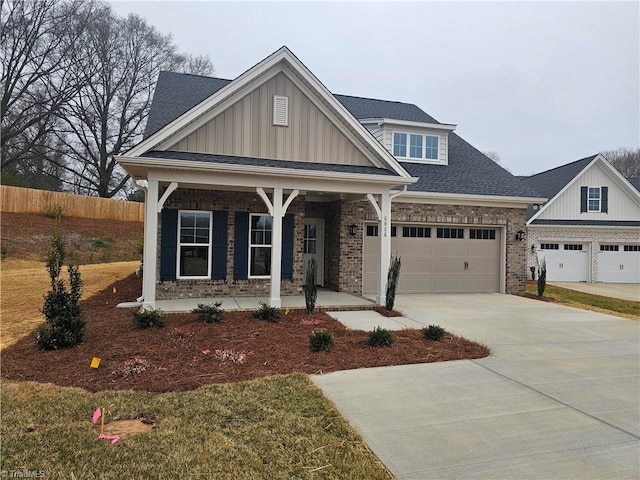 6036 Haywood St, Clemmons, NC 27012 - craftsman inspired home featuring covered porch, board and batten siding, brick siding, and fence