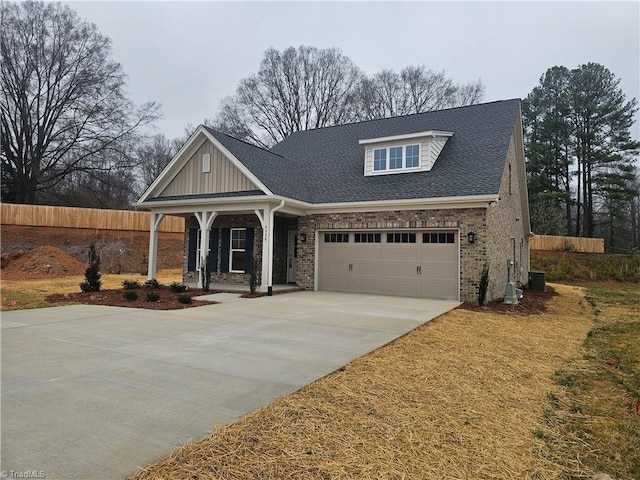 6036 Haywood St, Clemmons, NC 27012 - craftsman house with concrete driveway, a porch, brick siding, and fence