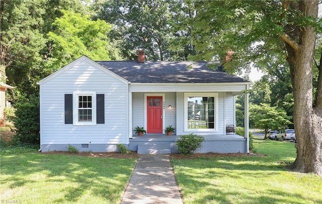 2904 Spring Garden St, Greensboro, NC 27403 - bungalow-style house with a porch, a front yard, a chimney, crawl space, and a shingled roof