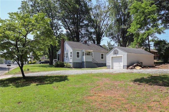 2904 Spring Garden St, Greensboro, NC 27403 - view of front of home with an outbuilding, a front lawn, a garage, and a chimney