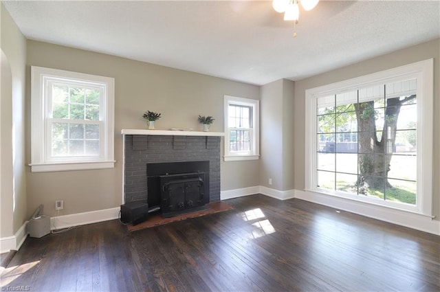 2904 Spring Garden St, Greensboro, NC 27403 - unfurnished living room featuring dark wood finished floors, a fireplace, and a ceiling fan