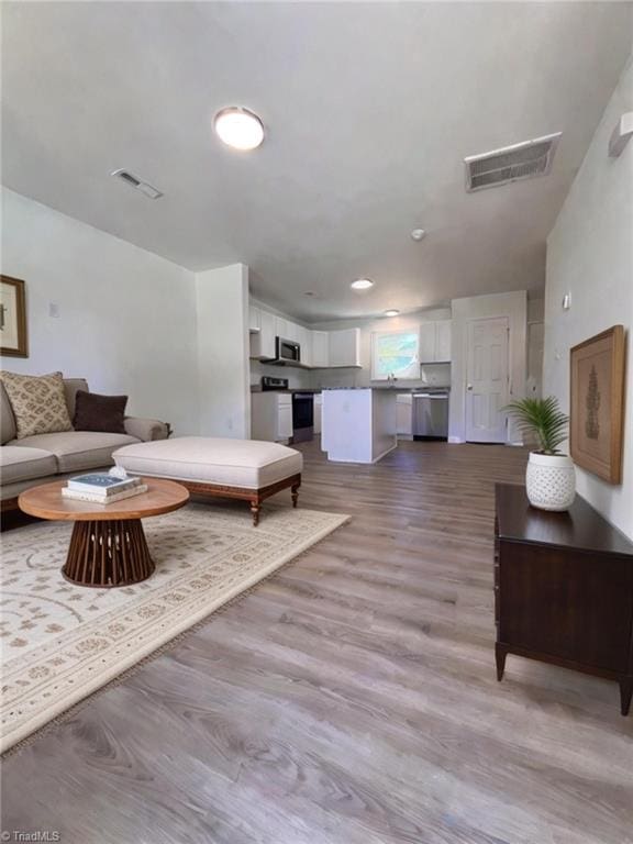 1609 Hardie St, Greensboro, NC 27403 - living area with wood finished floors