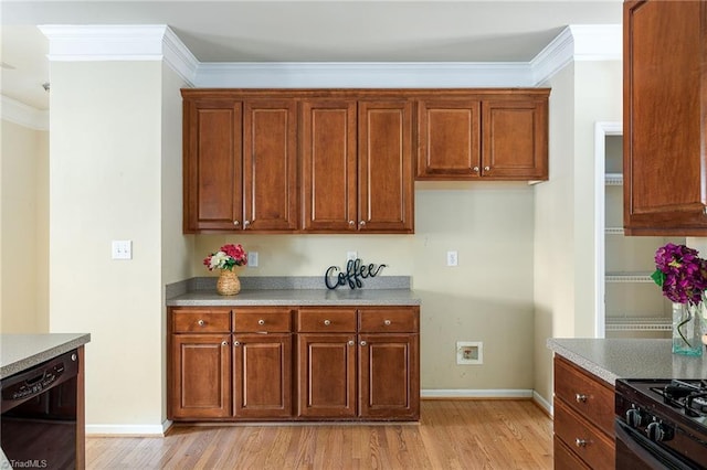 kitchen featuring black appliances, crown molding, and light wood-style floors