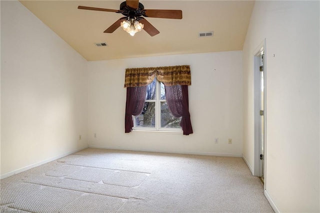 unfurnished room with visible vents, baseboards, light colored carpet, and ceiling fan