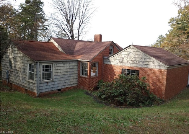 view of property exterior featuring a lawn