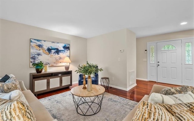 living area with wood finished floors, baseboards, and recessed lighting