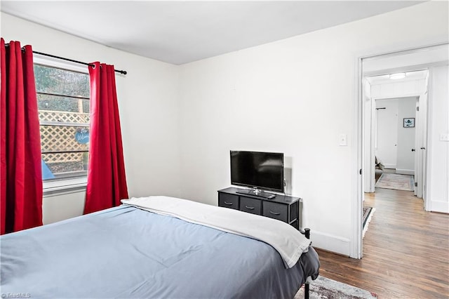 bedroom featuring wood-type flooring