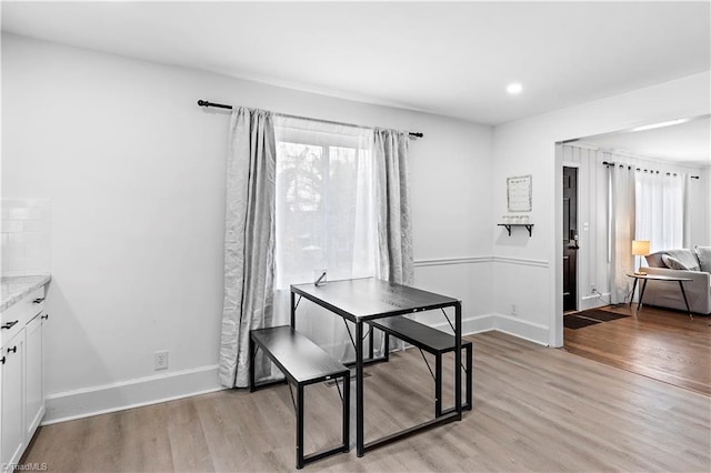 dining area featuring light wood-type flooring