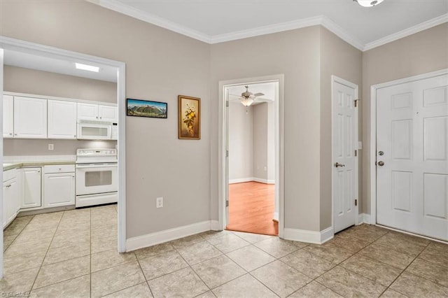 kitchen with ceiling fan, white cabinetry, light tile patterned floors, white appliances, and ornamental molding