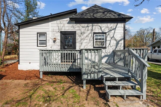 back of property featuring a deck