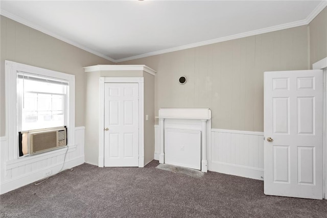 unfurnished room with crown molding, cooling unit, and dark colored carpet