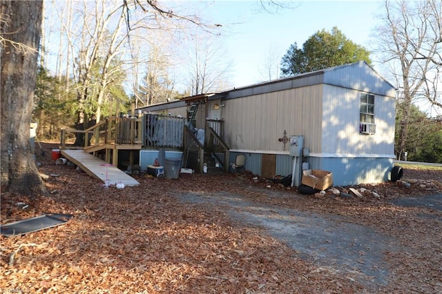 view of property exterior with a deck