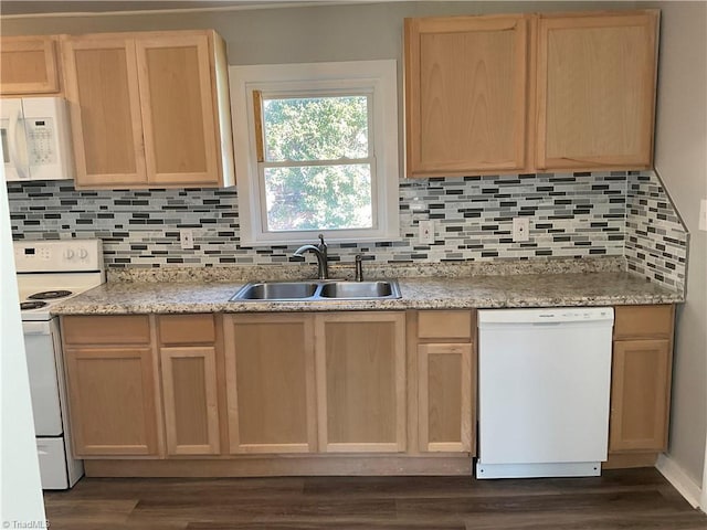 kitchen with tasteful backsplash, sink, white appliances, and light brown cabinets