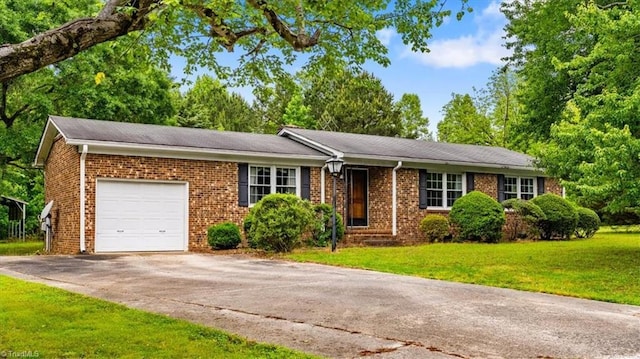 318 Sedalia Rd, Gibsonville, NC 27249 - ranch-style house with an attached garage, driveway, a front lawn, and brick siding