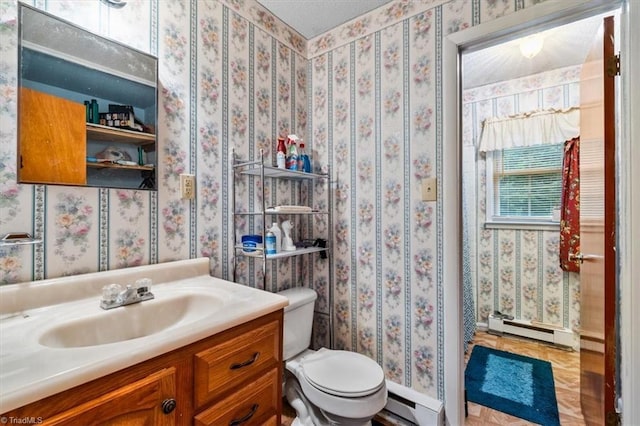 318 Sedalia Rd, Gibsonville, NC 27249 - bathroom featuring a baseboard radiator, toilet, and vanity
