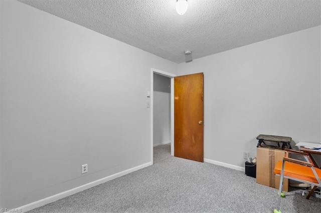 318 Sedalia Rd, Gibsonville, NC 27249 - carpeted home office with a textured ceiling and baseboards