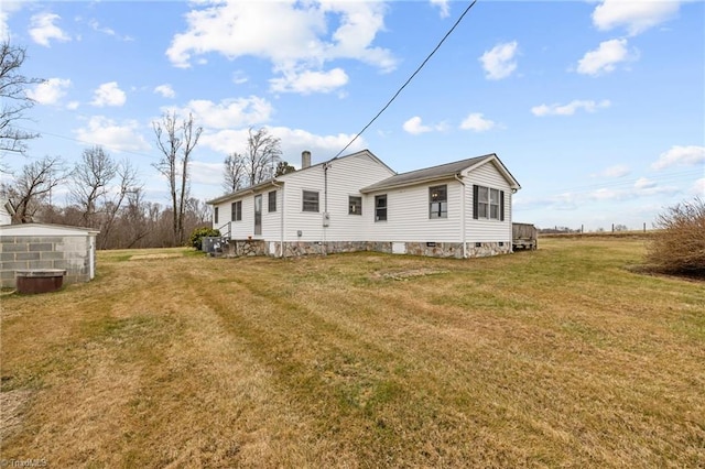 view of side of property with a lawn