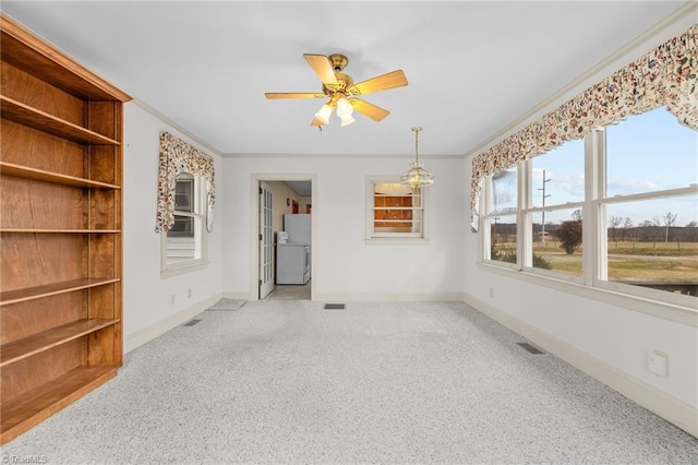 spare room featuring ceiling fan, light carpet, and crown molding