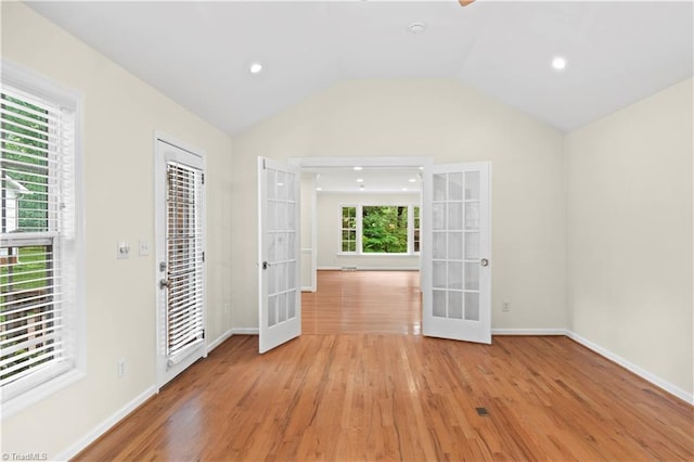 1022 Willowlake Rd, Winston-Salem, NC 27106 - empty room featuring french doors, light wood-type flooring, baseboards, lofted ceiling, and recessed lighting