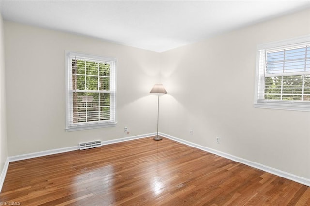 1022 Willowlake Rd, Winston-Salem, NC 27106 - spare room featuring wood finished floors and baseboards