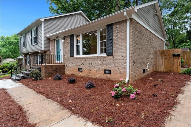 1022 Willowlake Rd, Winston-Salem, NC 27106 - tri-level home featuring crawl space and brick siding