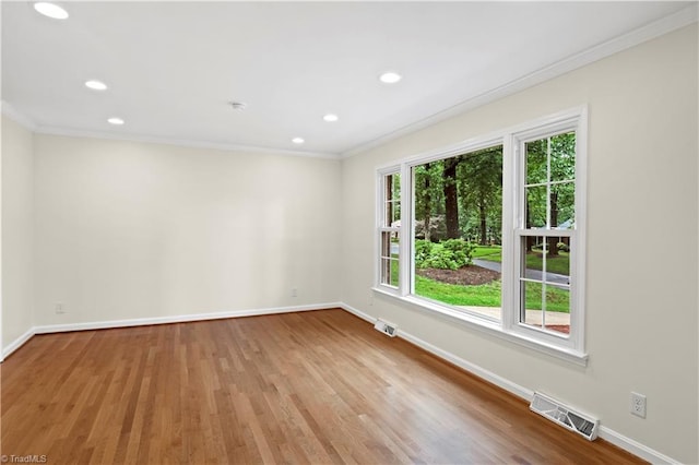 1022 Willowlake Rd, Winston-Salem, NC 27106 - unfurnished room featuring crown molding, baseboards, light wood-style flooring, and recessed lighting