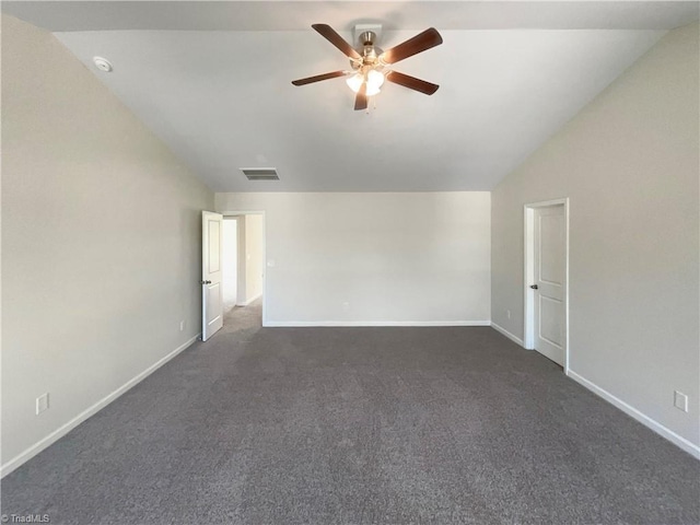 unfurnished room featuring vaulted ceiling, dark colored carpet, baseboards, visible vents, and a ceiling fan