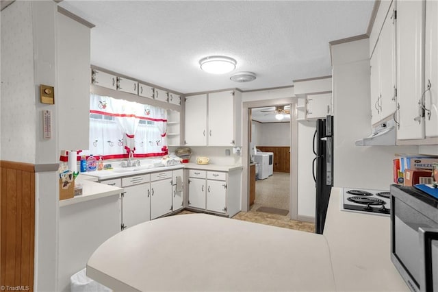 kitchen with sink, white cabinetry, a textured ceiling, exhaust hood, and kitchen peninsula