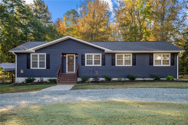 ranch-style home featuring a front yard