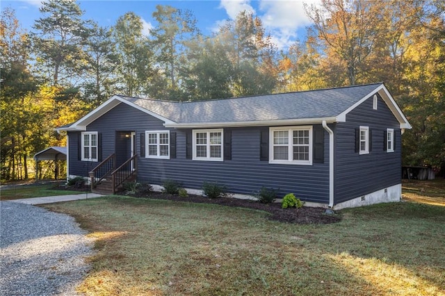 ranch-style home with a front lawn