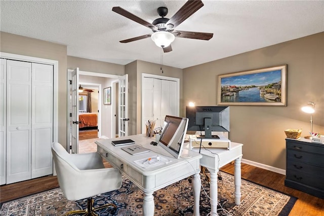 6404 Muirfield Dr, Greensboro, NC 27410 - office area with ceiling fan, baseboards, wood finished floors, and french doors