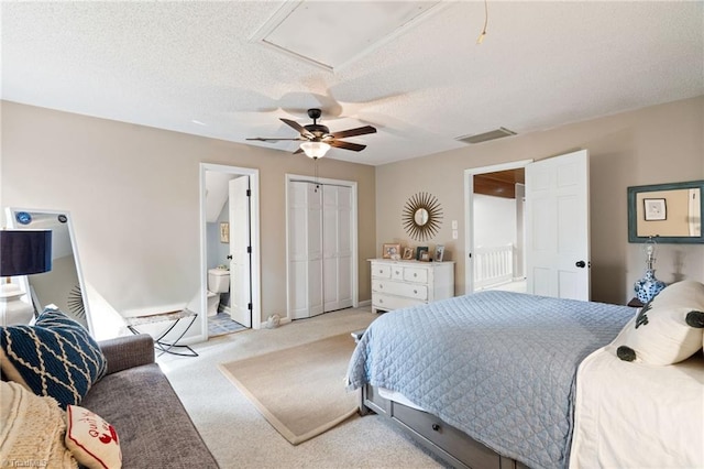 6404 Muirfield Dr, Greensboro, NC 27410 - bedroom with carpet flooring, a textured ceiling, connected bathroom, a ceiling fan, and a closet